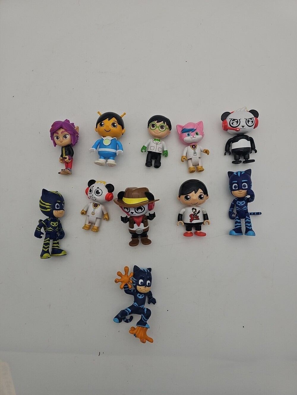 Lot of 11 used Ryan's World and PJ Masks figures. Good condition. Fun toy bundle